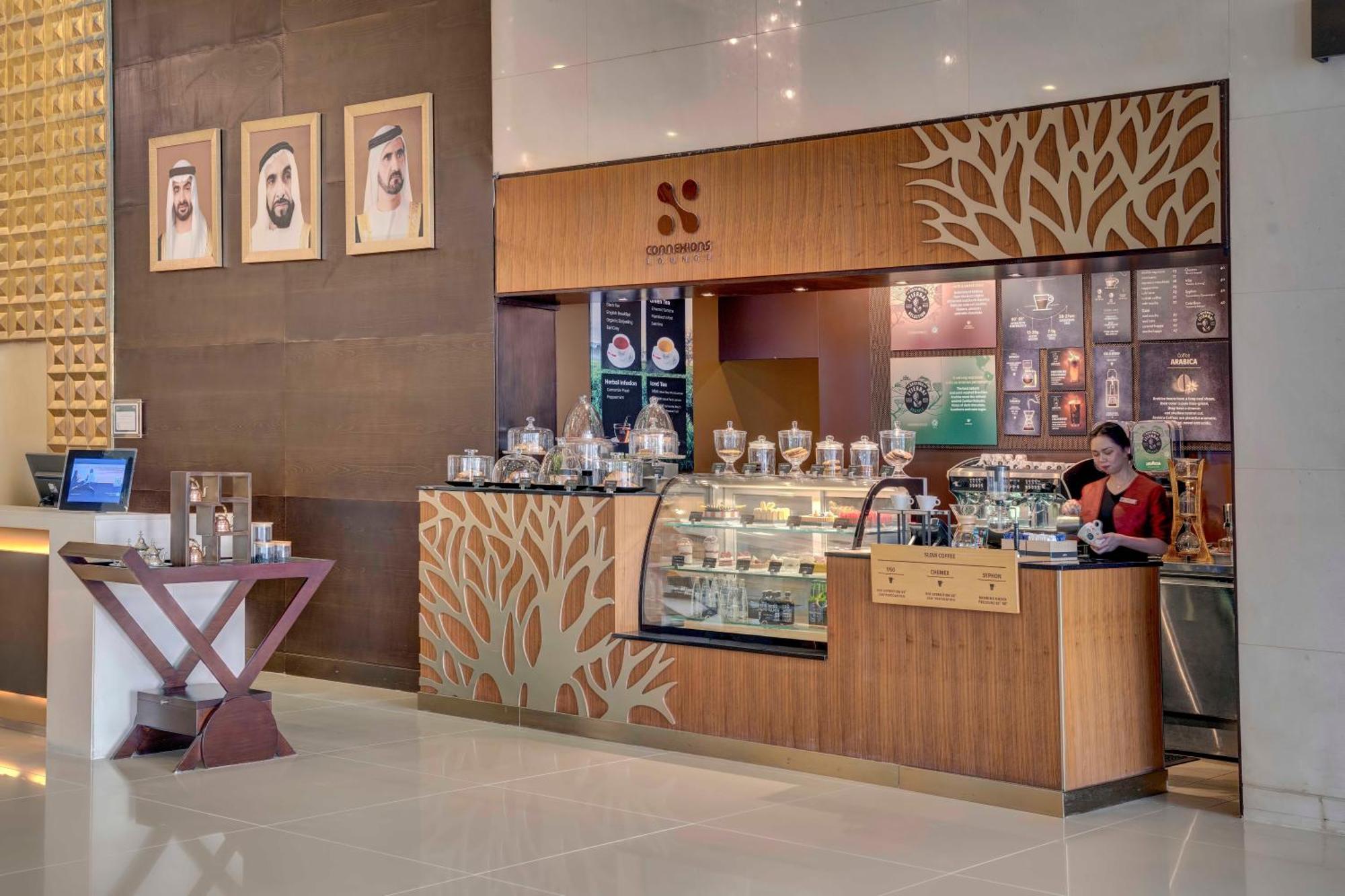 Отель Media Rotana Дубай Экстерьер фото A Starbucks in the lobby of the Ritz-Carlton, DIFC, Dubai, United Arab Emirates
